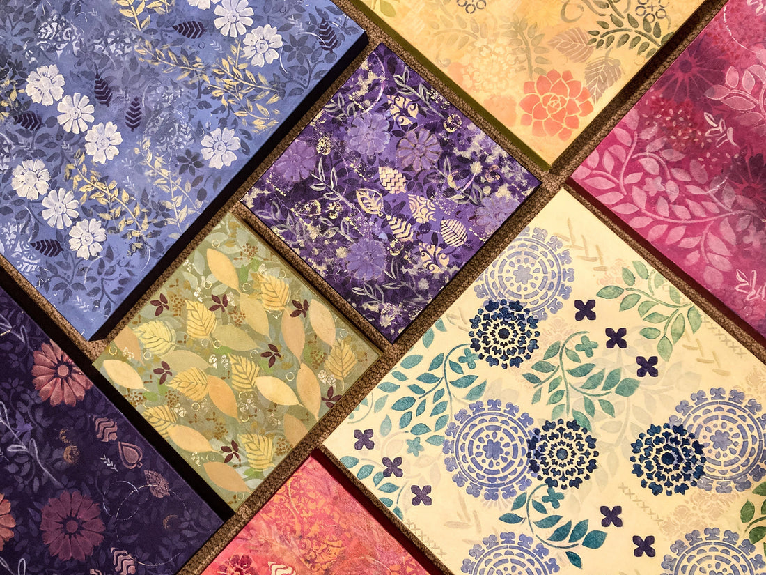patterned paintings in purple, red, yellow and green laid out together in a patchwork style