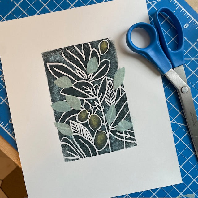 Linocut print with image of an olive branch and a pair of scissors