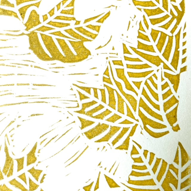 Detail image of fall leaf linocut print by Katie Weaver with winding gold leaf motifs