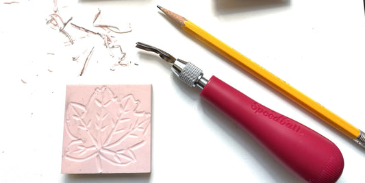 Small linocut carving by Katie Weaver with tools