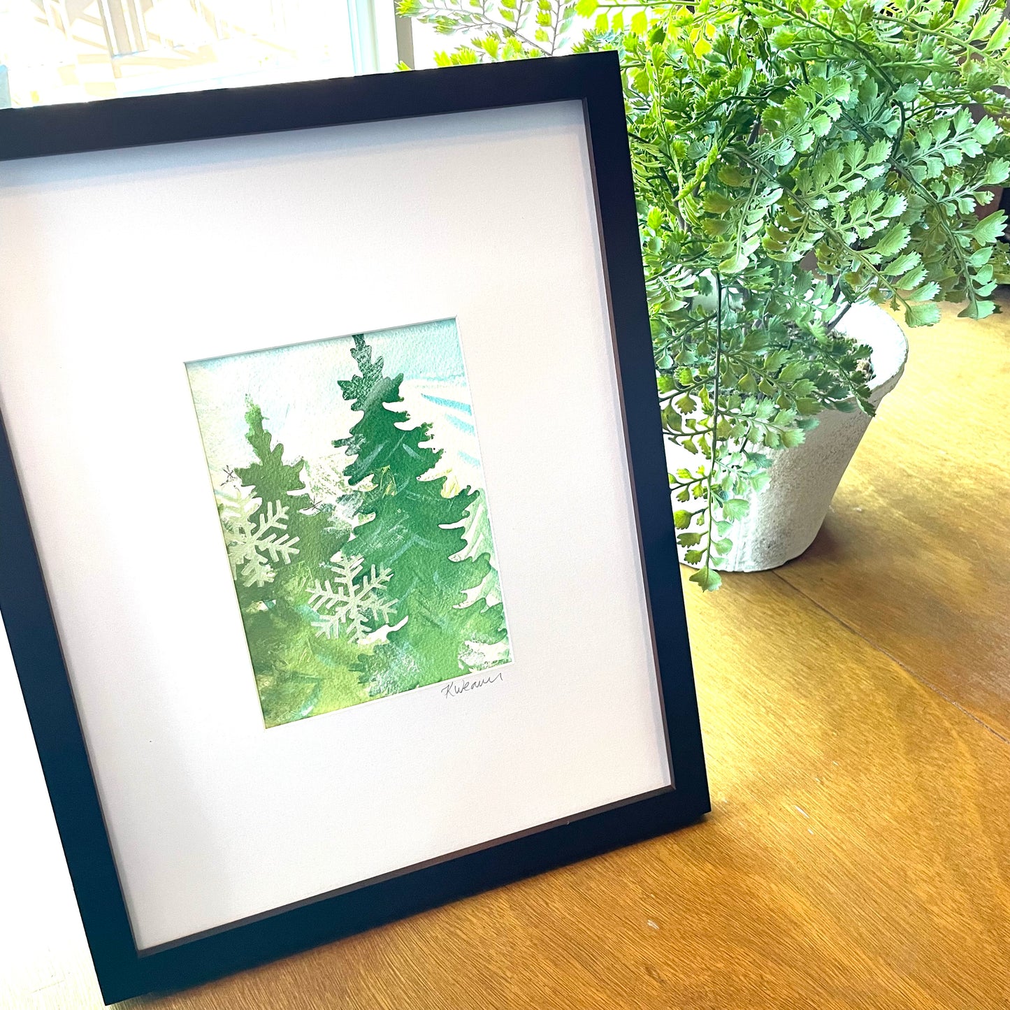 Evergreen painting with snowflakes
