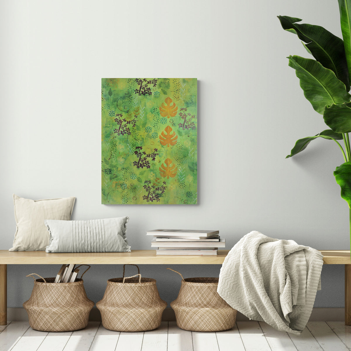 Vibrant green forest‑inspired painting by Katie Weaver with vertical orange leaves displayed in a cozy entryway