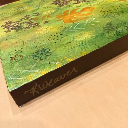 Side view of vibrant green forest‑inspired painting by Katie Weaver with vertical orange leaves