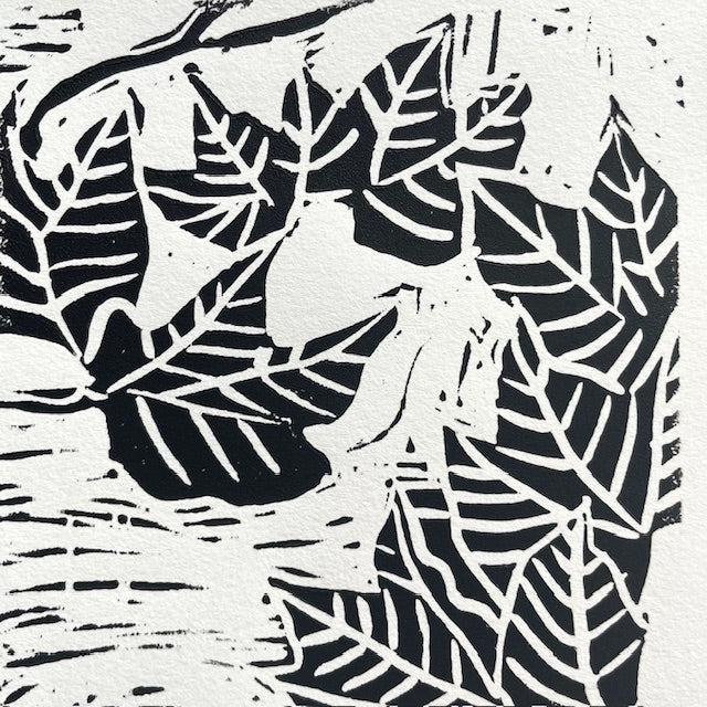 Detail image of fall leaf linocut print by Katie Weaver with winding black leaf motifs 