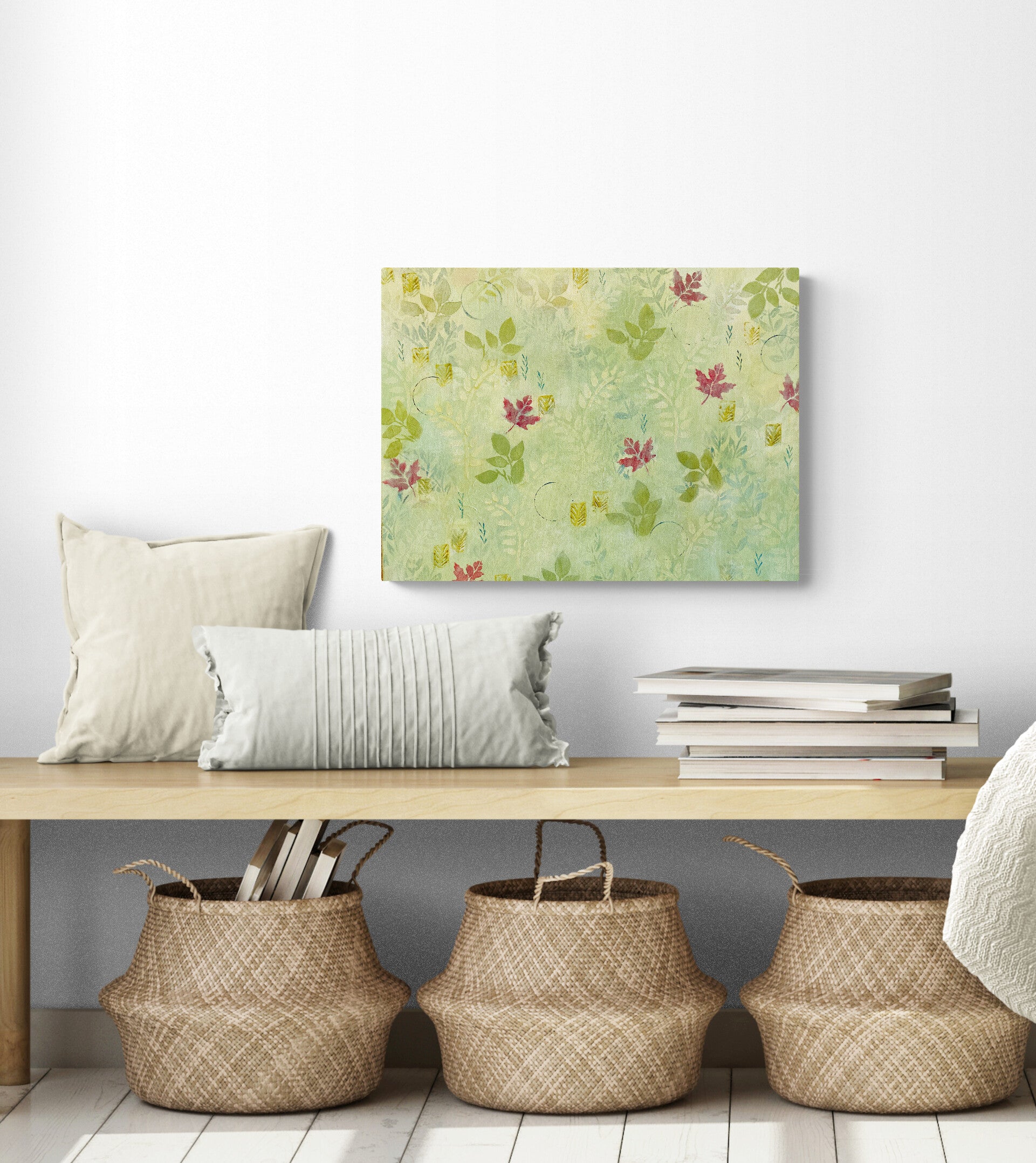 acrylic painting with light green background and leaves red maple leaves abstract pattern bright and cheerful shown in room with bench and baskets below