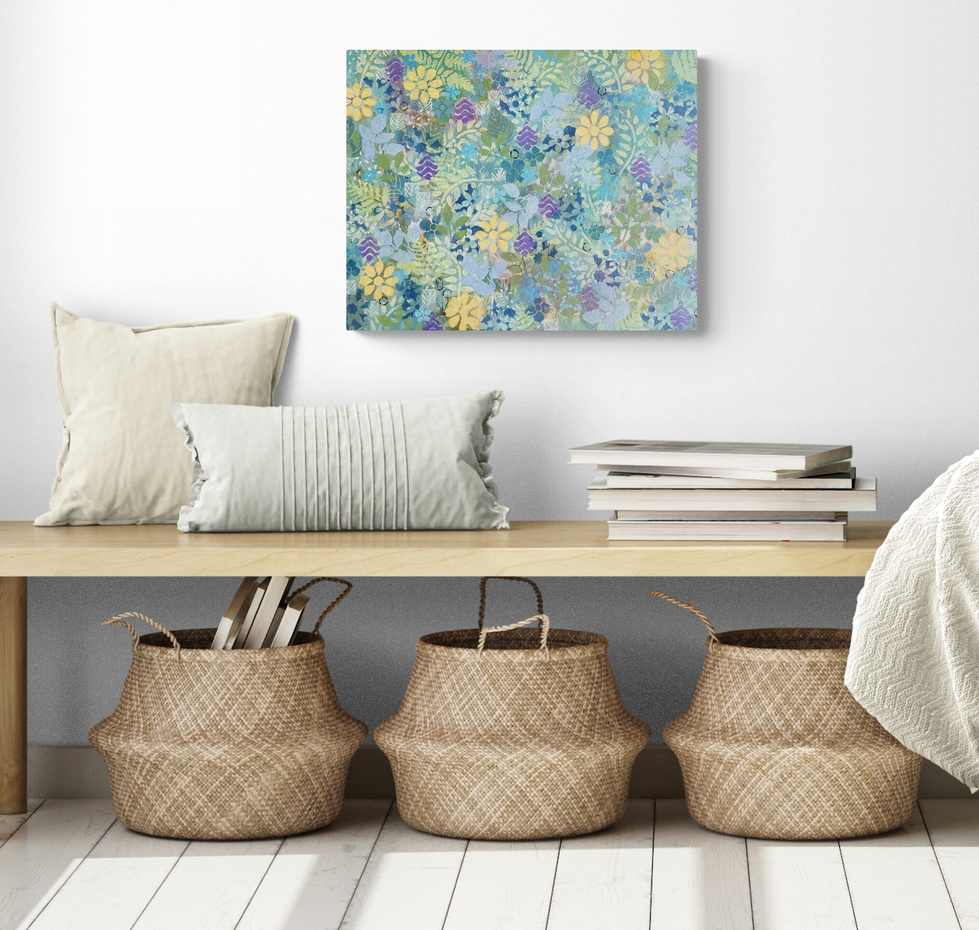 abstract floral painting on canvas sunny yellow flowers and small blue flowers green leaves purple accents refreshing jungle feel in room with bench and baskets below