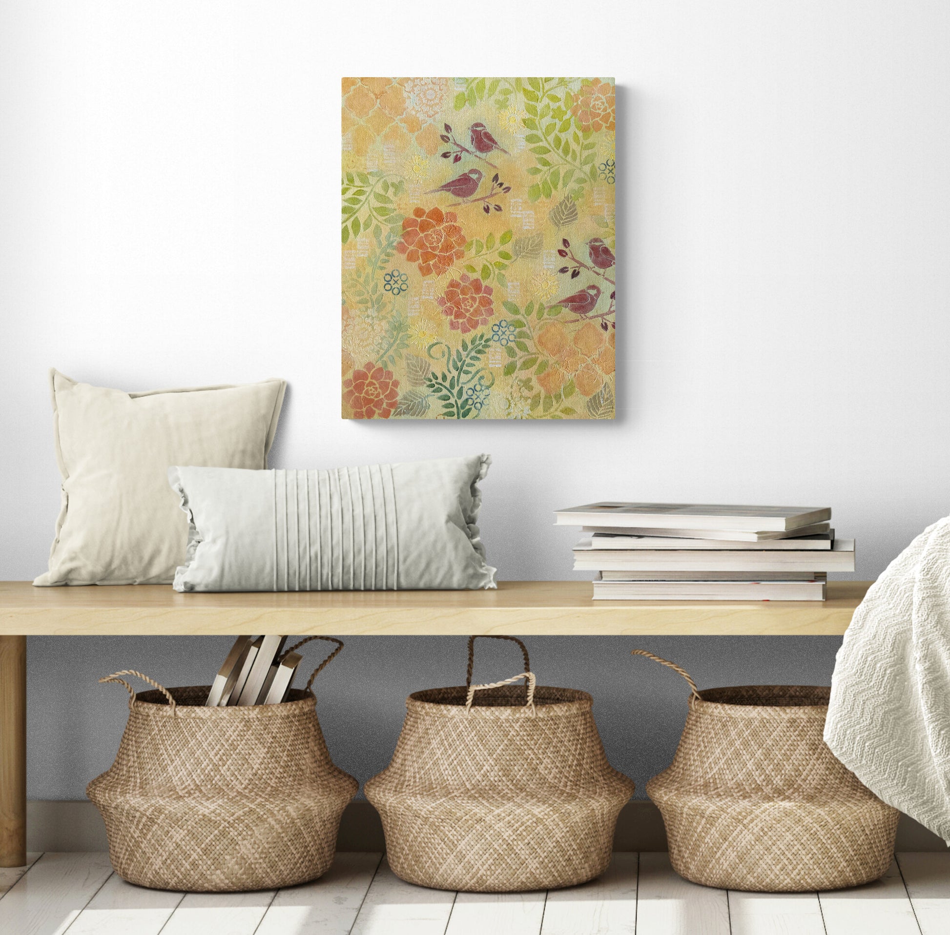 Original abstract acrylic painting botanical scene with yellow background green leaves orange flowers red birds cheerful feeling shown in room with bench and baskets