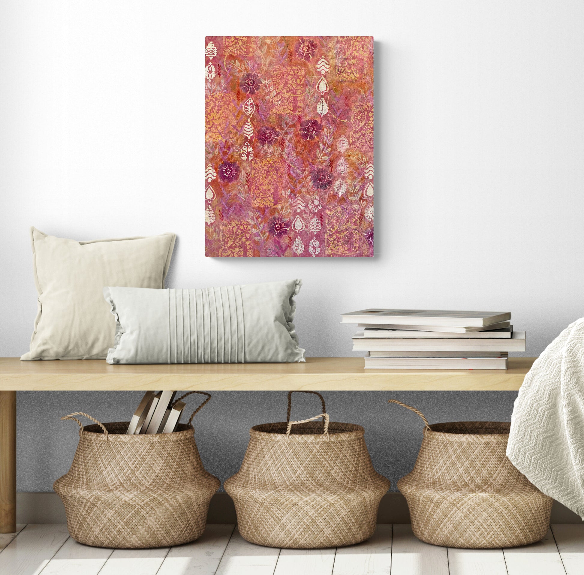 original acrylic painting on canvas dark red flowers on red background with white leaves and orange accents warm cheerful feeling shown in room with a bench and baskets